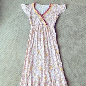 Pink and yellow floral maxi dress, cinched waistline and coral floral details.